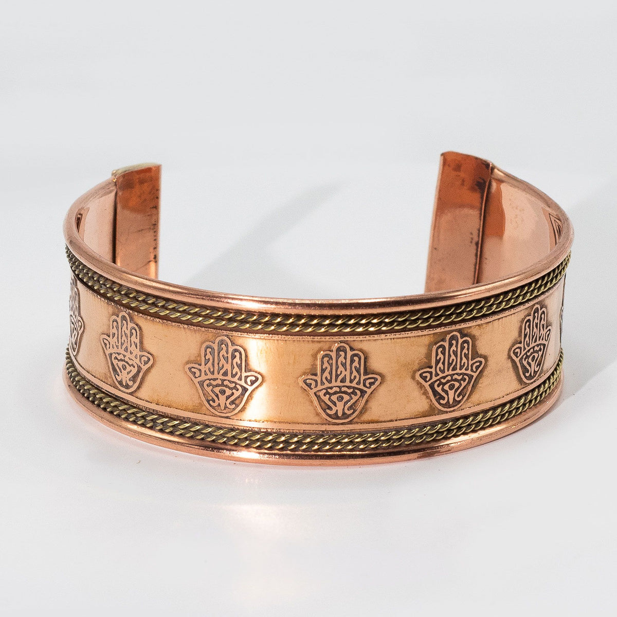 Pulsera de cobre ancha con decoración de latón