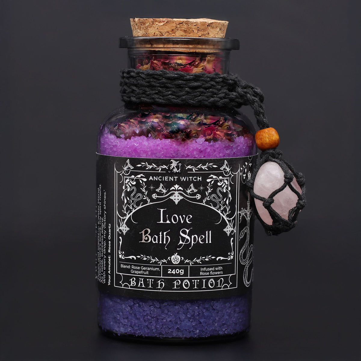 Poción de baño de bruja antigua con amuleto de cuarzo rosa · Amor