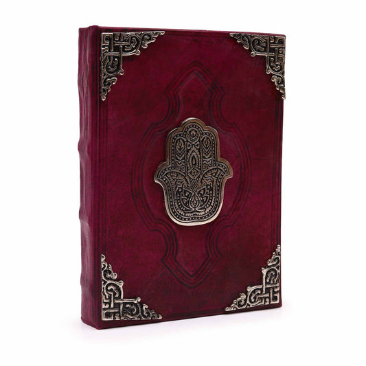 Cuaderno de cuero rojo · Hamsa de zinc