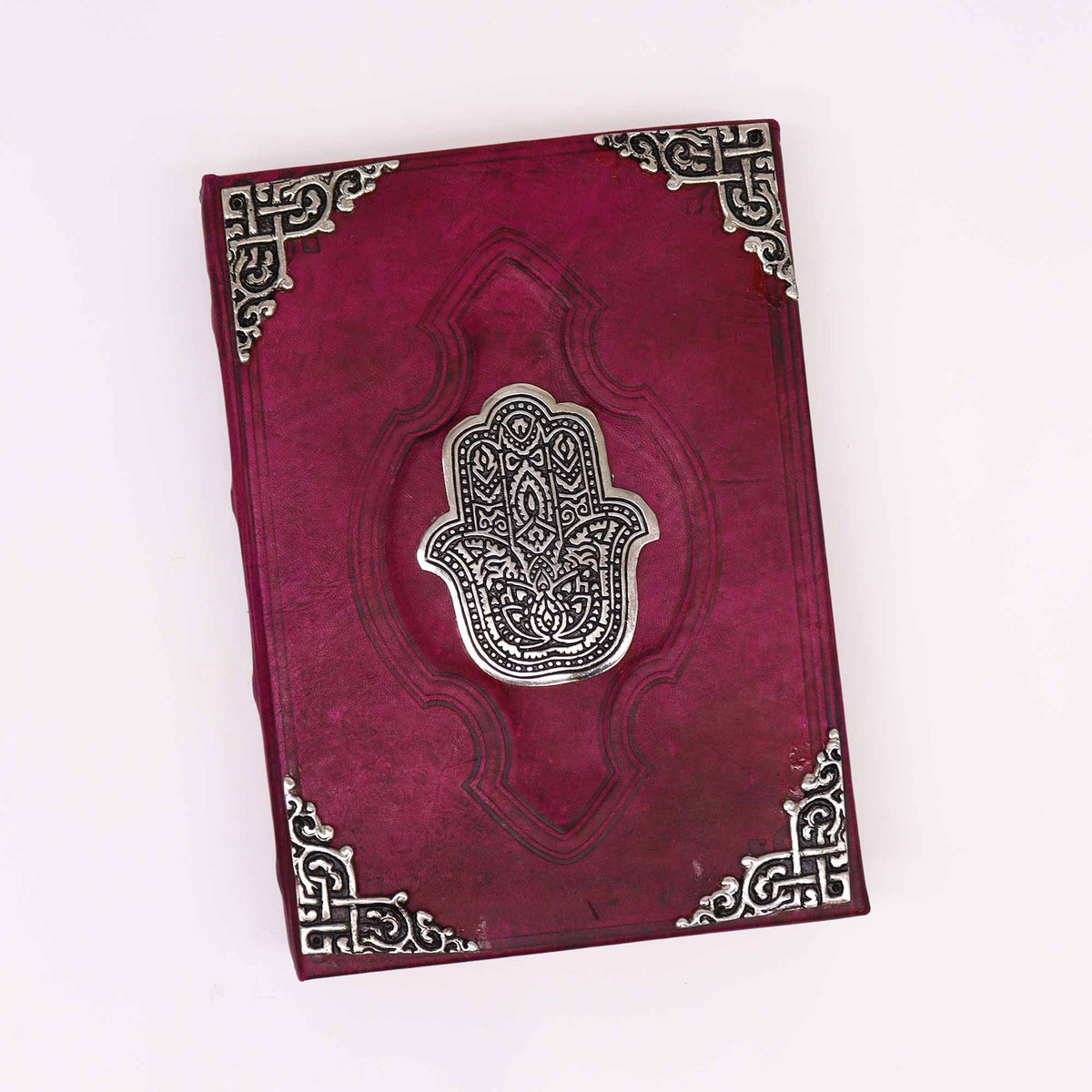 Cuaderno de cuero rojo · Hamsa de zinc