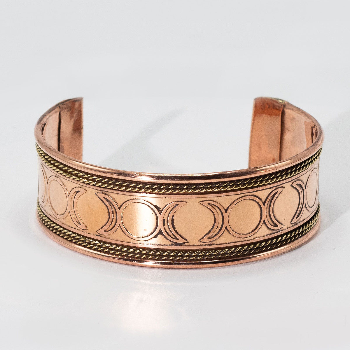 Pulsera de cobre ancha con decoración de latón