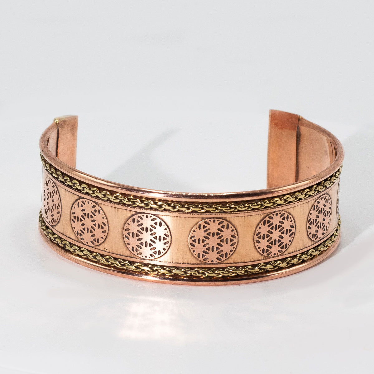Pulsera de cobre ancha con decoración de latón