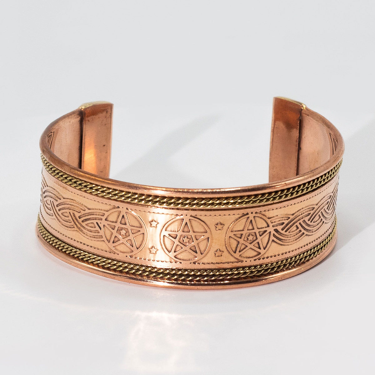 Pulsera de cobre ancha con decoración de latón